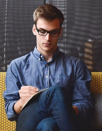 student relaxing on sofa